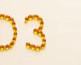 Kapsułki z witaminą D3 ułożone w napis "D3", symbolizujące walkę z niedoborem witaminy D.