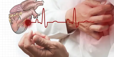 Ból lewej ręki może być objawem problemów z sercem. Rysunek serca i EKG na tle dłoni.